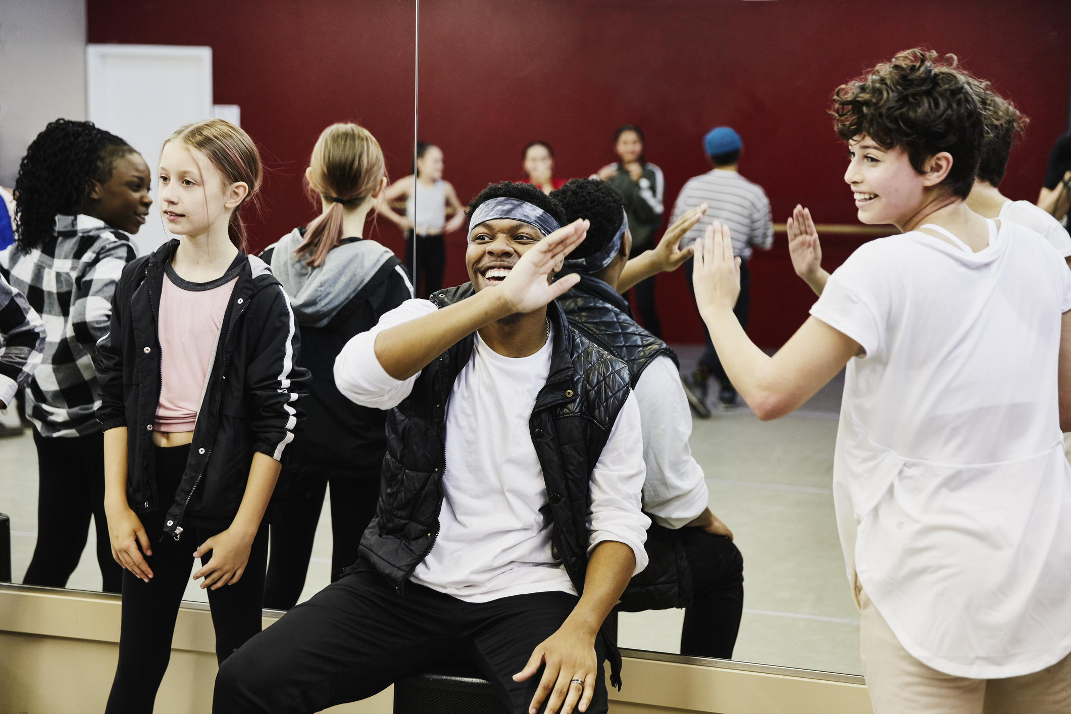 Teens acting out a scene in drama class.